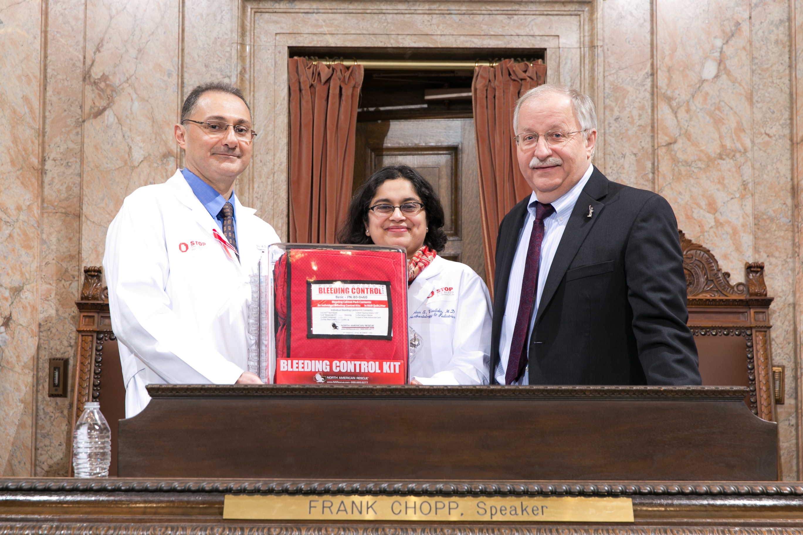 WA-ACS members present a bleeding control kit with Speaker Frank Chopp